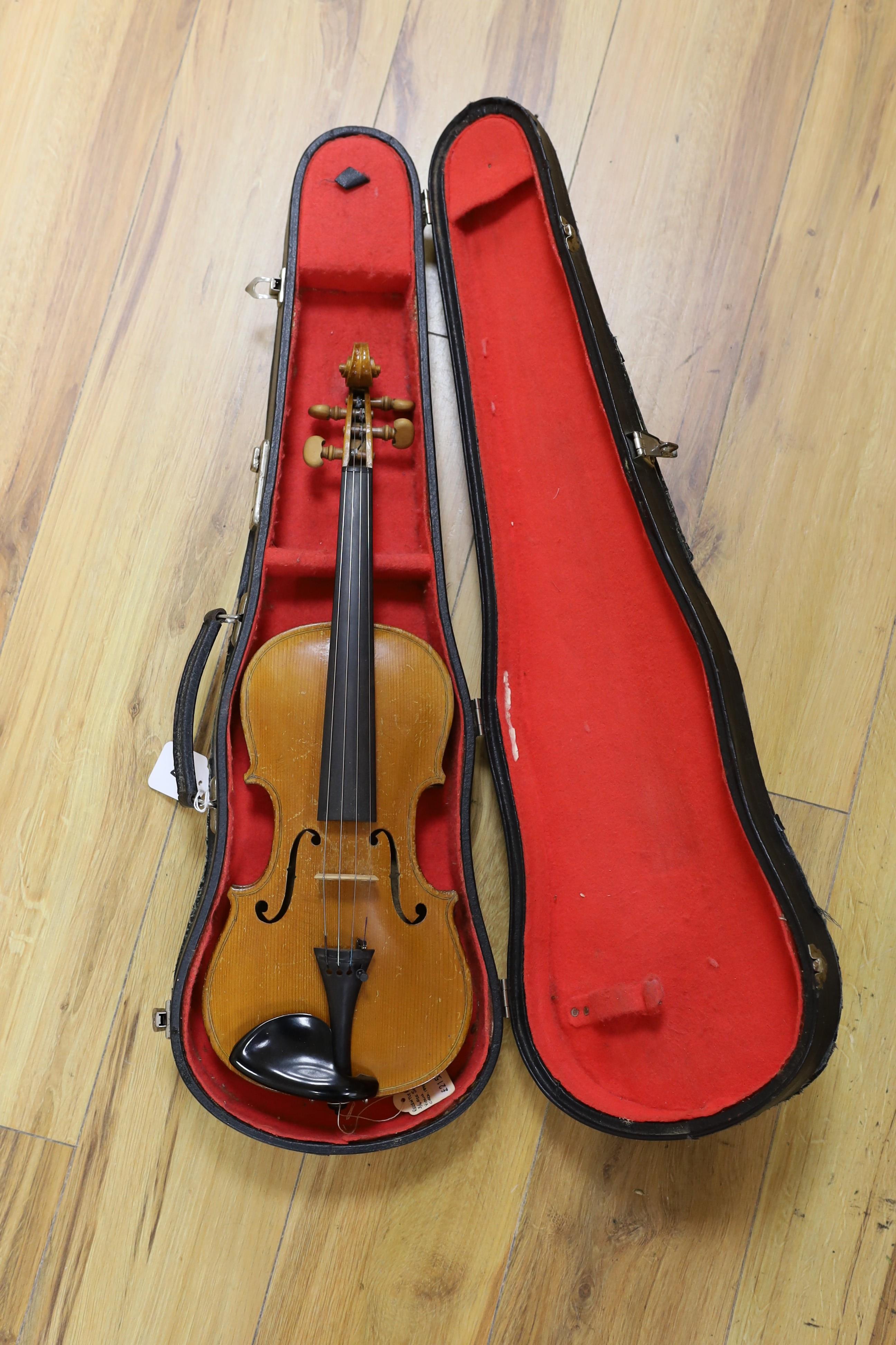 A cased student's violin, length of back 33 cm